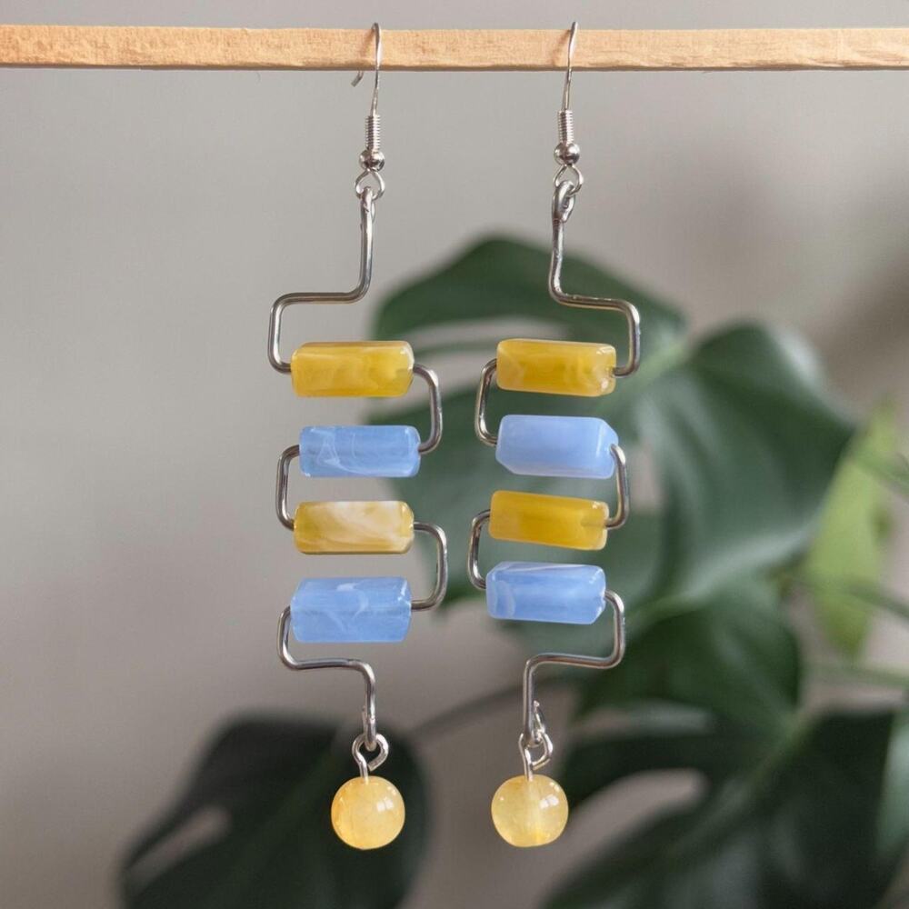 handmade silver earrings with blue & yellow tube beads and a yellow round bead